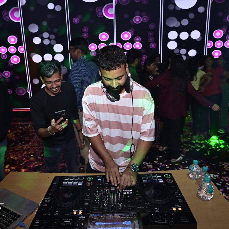 DJ playing music at a college freshers party.