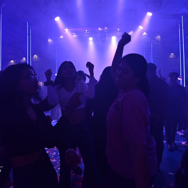 Students dancing at a college freshers party.