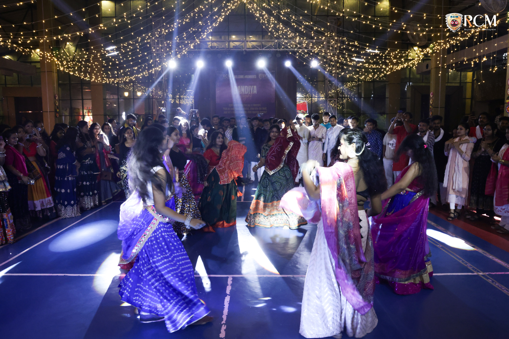 Students dancing amidst vibrant decorations during Mega Dandiya Night 2025, one of Bhubaneswar’s best college events.