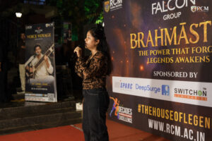 Students performing solo songs during Voice Voyage Brahmastra 2026 annual college cultural festival at RCM